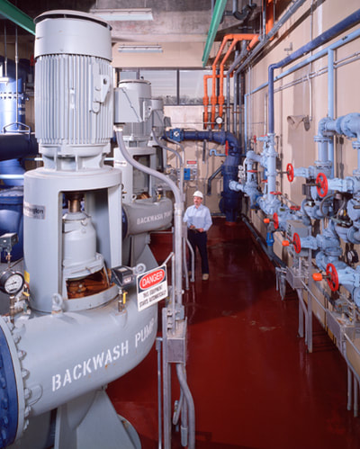 operator in pump room of a water treatment facility